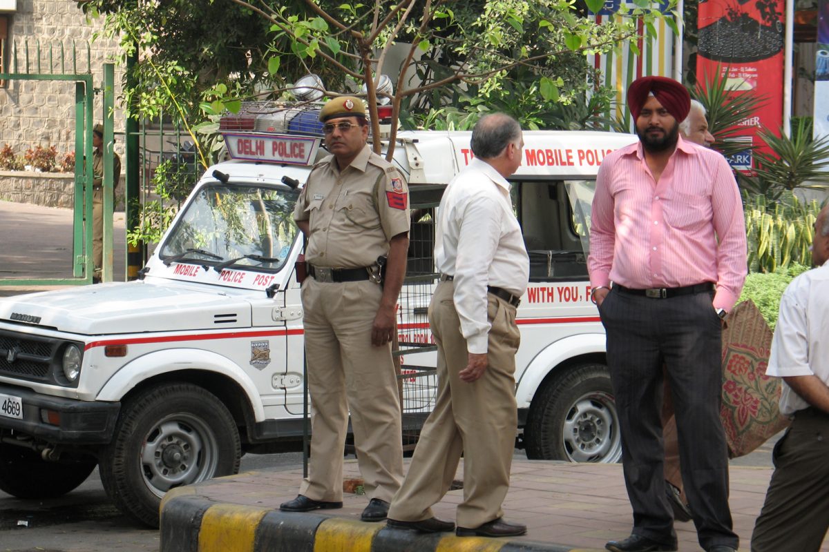 A man on a street wearing a turban