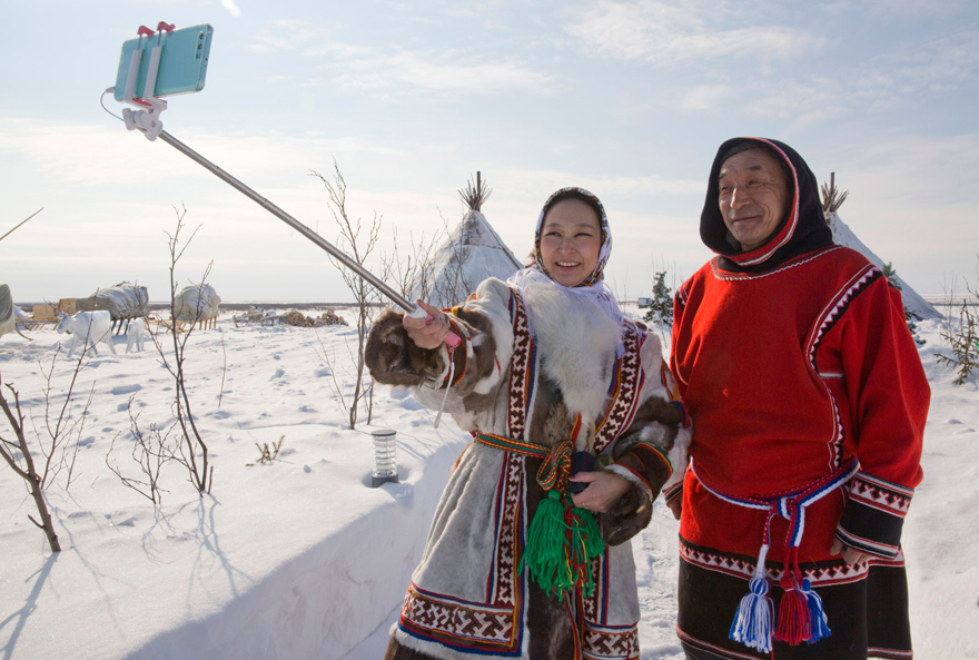 Two people taking selfie in the snow