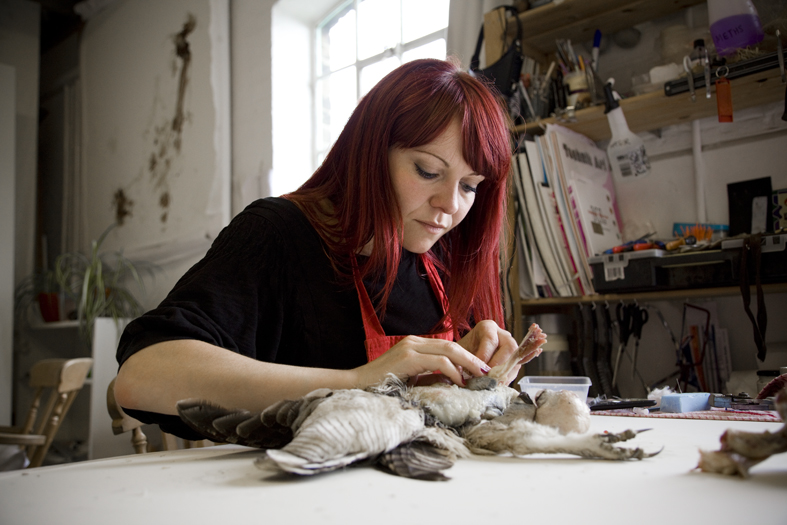 woman with red hair at craft table