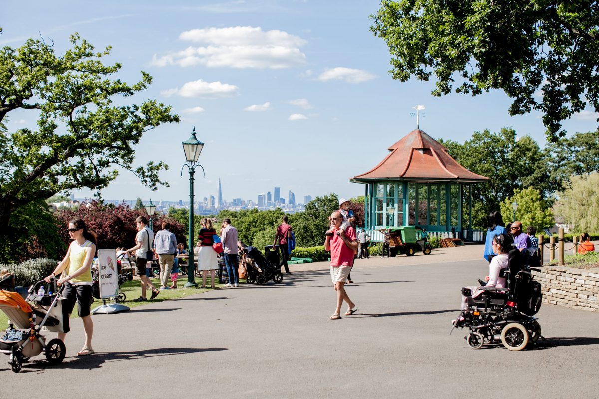 A terrace in the Horniman Gardens with people walking across it.