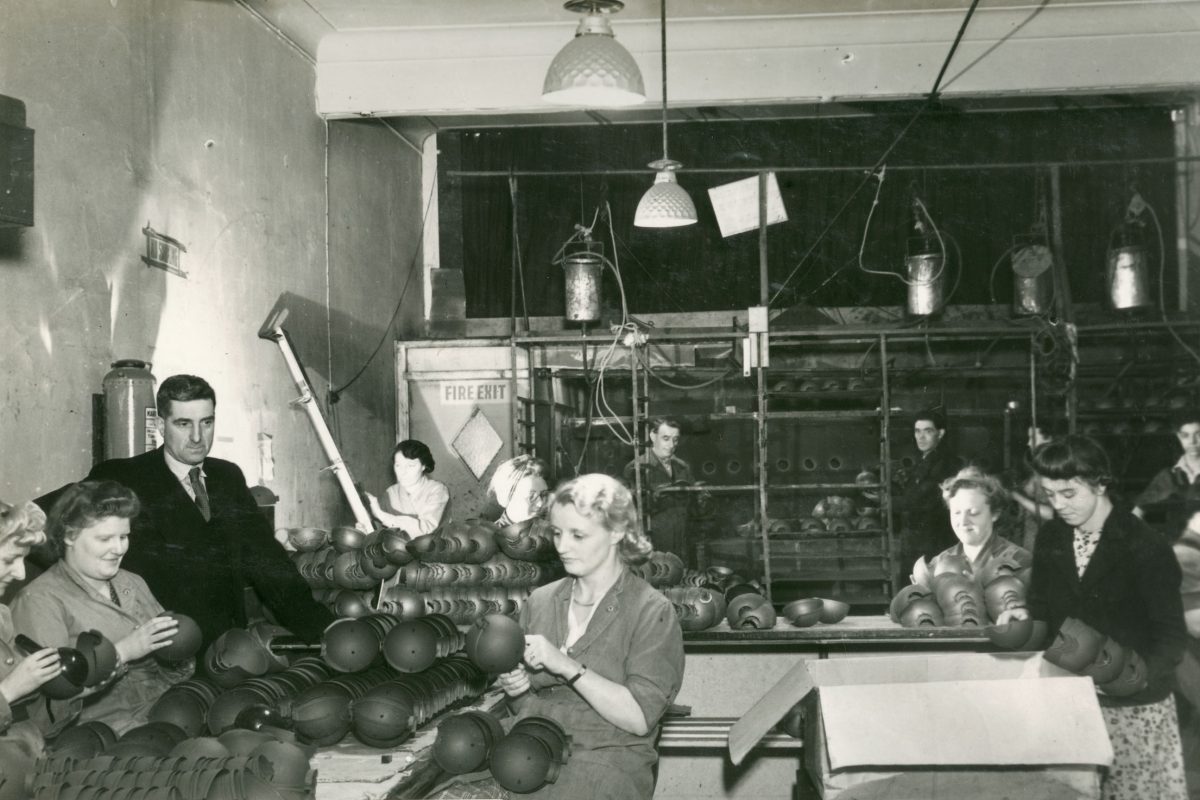 People inspecting bombs