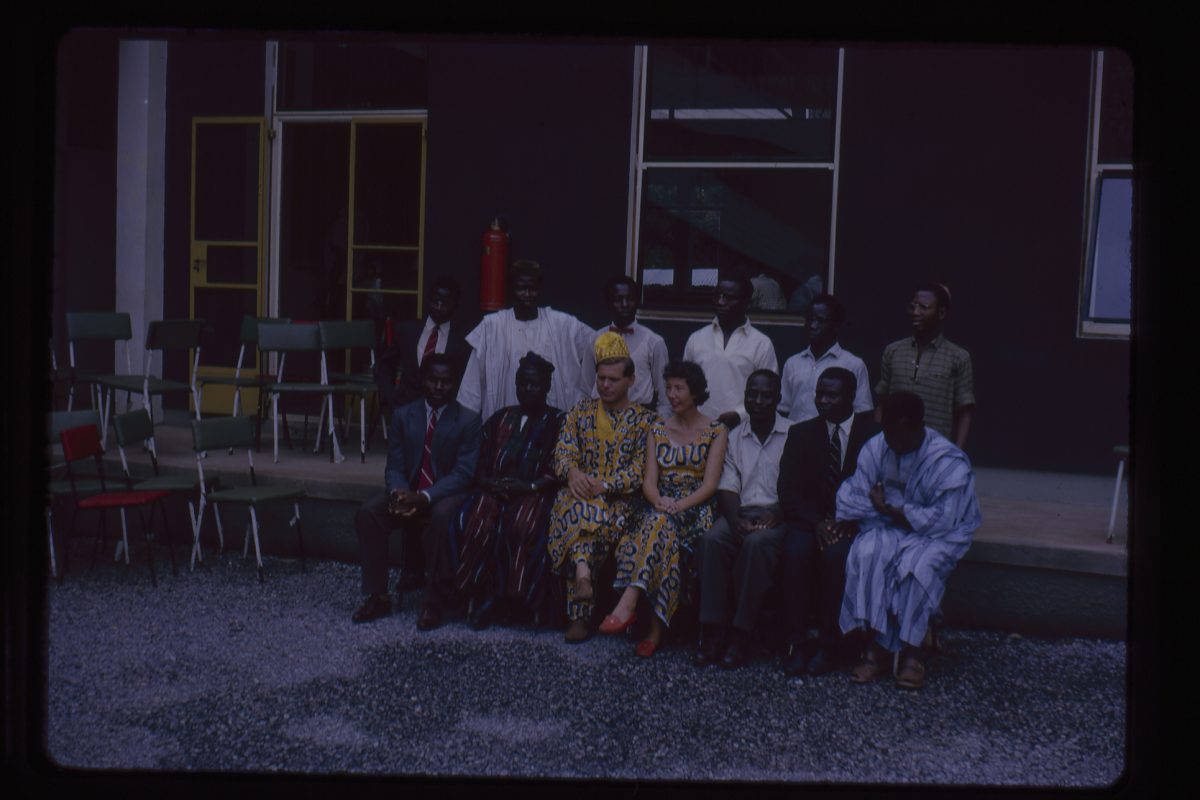 Group of people sitting posed for a picture being taken