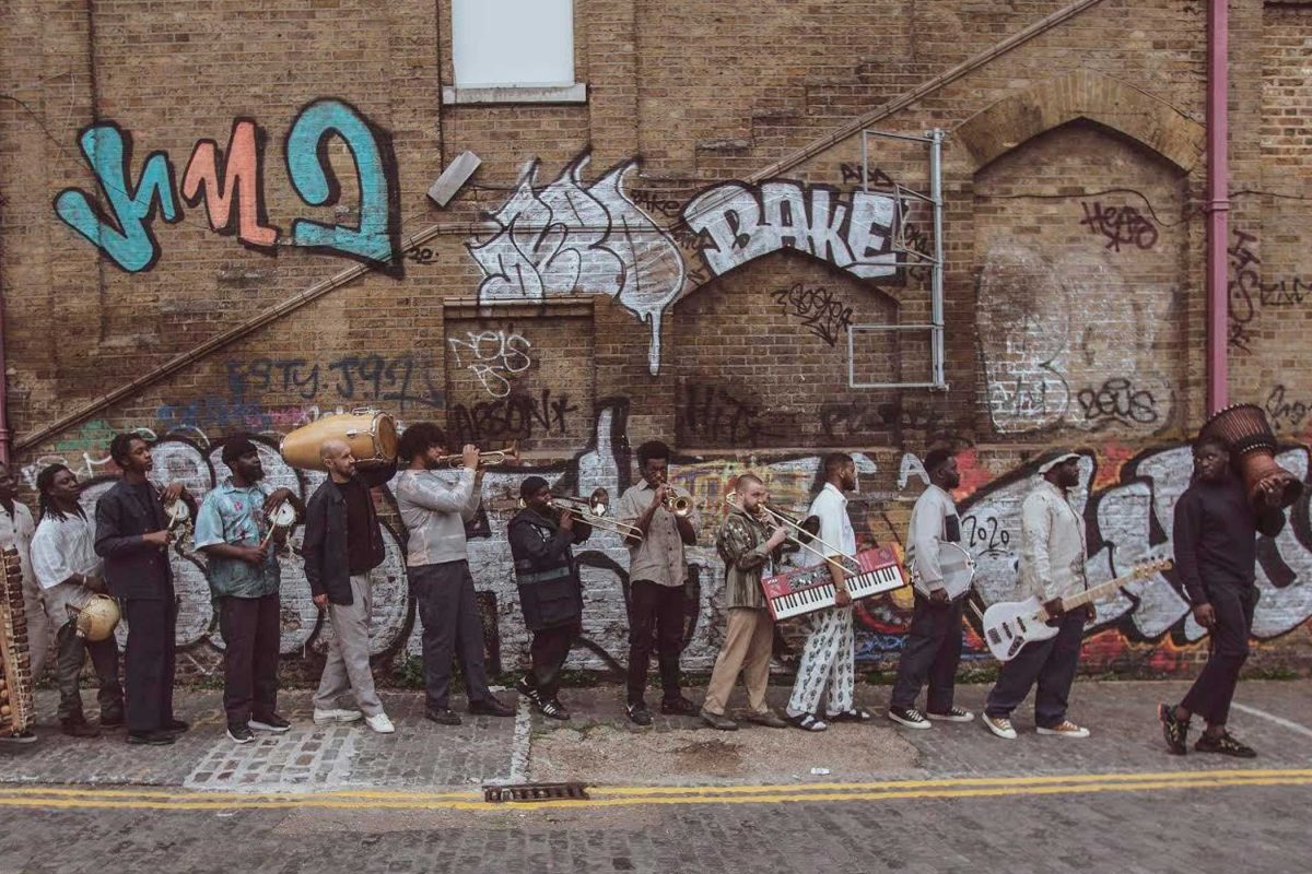 A row of musicians all holding instruments