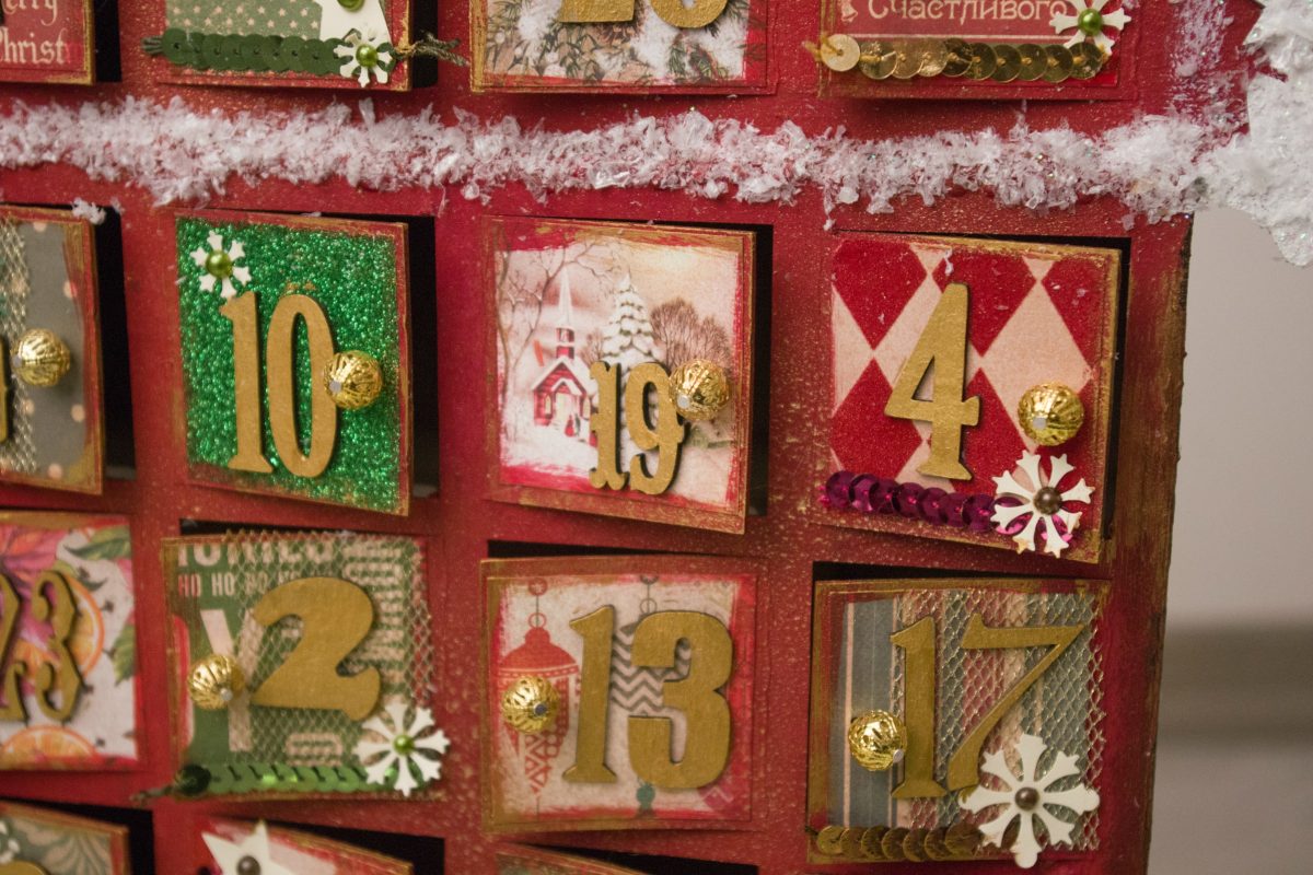 A reusable advent calendar with colourfully decorated doors