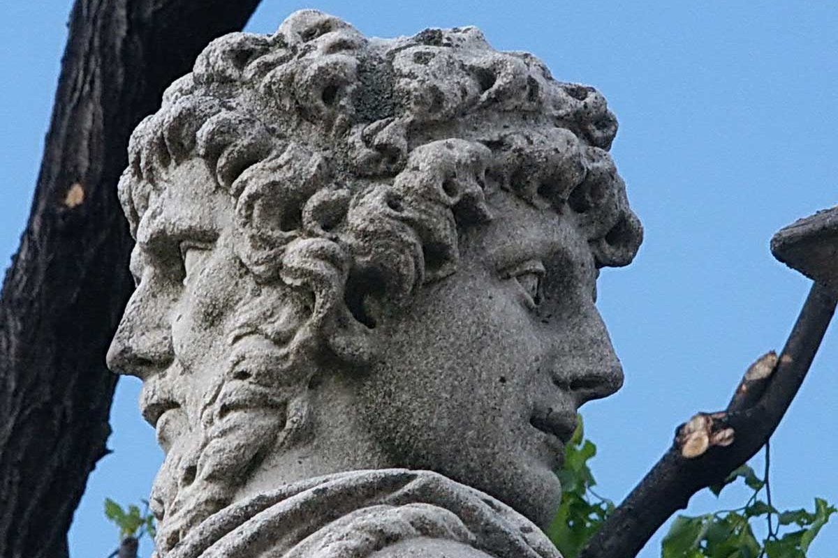 Statue of Janus, with one face forwards and one facing backwards