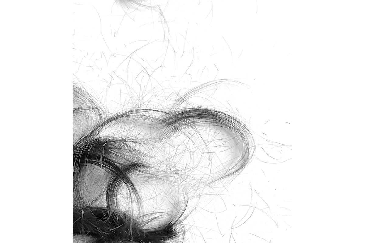 Black and white close up photo of cut hair