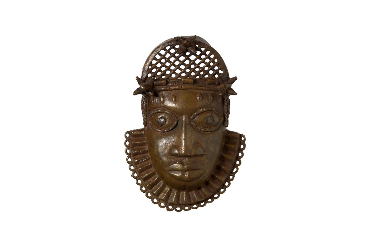 A pectoral mask of a face and collar