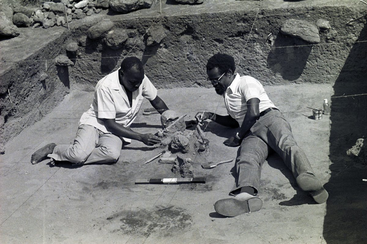 Archive photo of Kamoya Kimeu and John Onyango, two prominent Kenyan archaeologists, excavating a Neolithic burial site