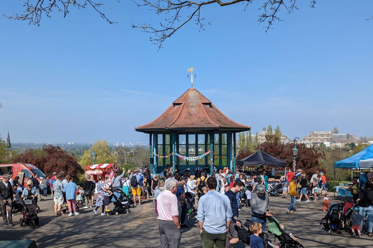 Bandstand Terrace and Bandstand dotted with people and stalls