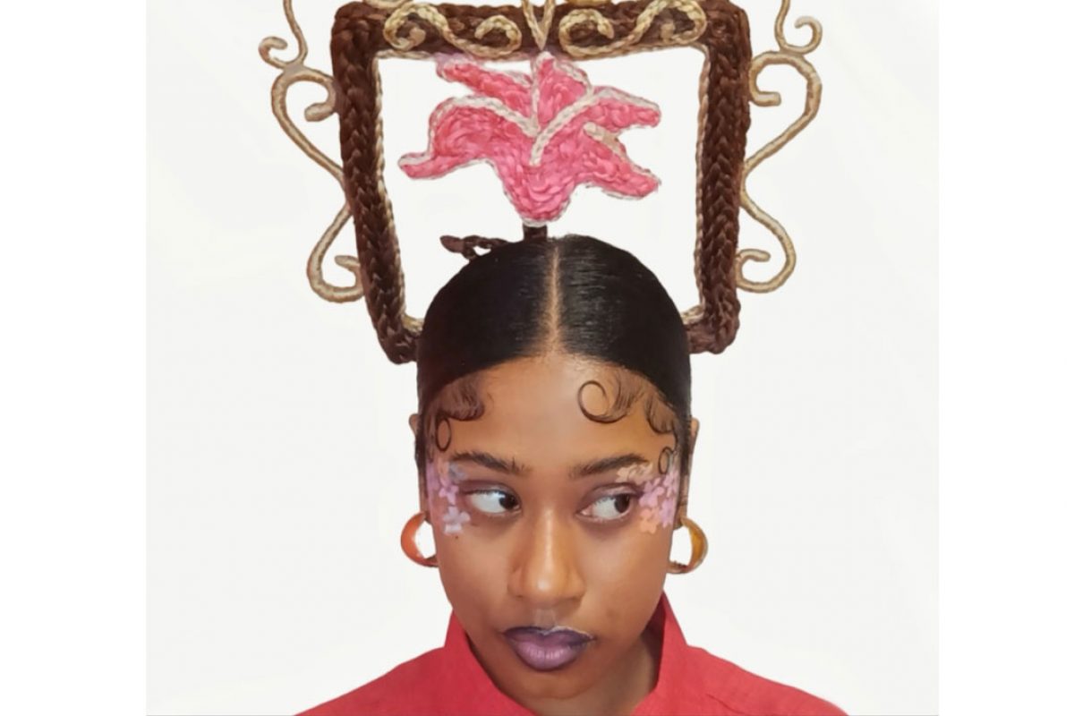 Woman with her hair formed into a plaited square on top of her head